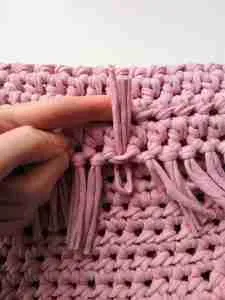 Adding Fringe and tassels to t shirt yarn crochet bag